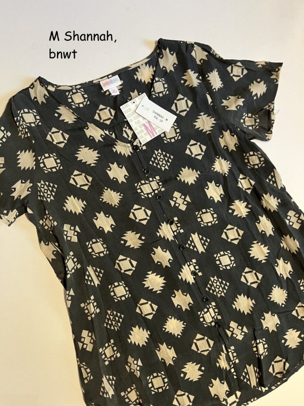 Medium Lularoe Shannah button top, grey with beige SW symbols